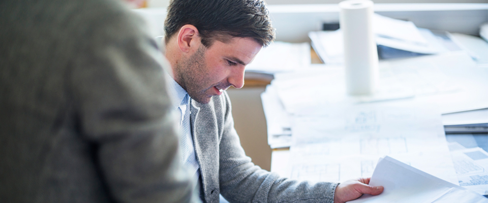 Picture of man looking at paper