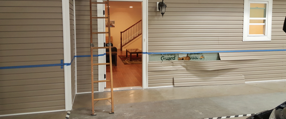 Picture of front door with ladder