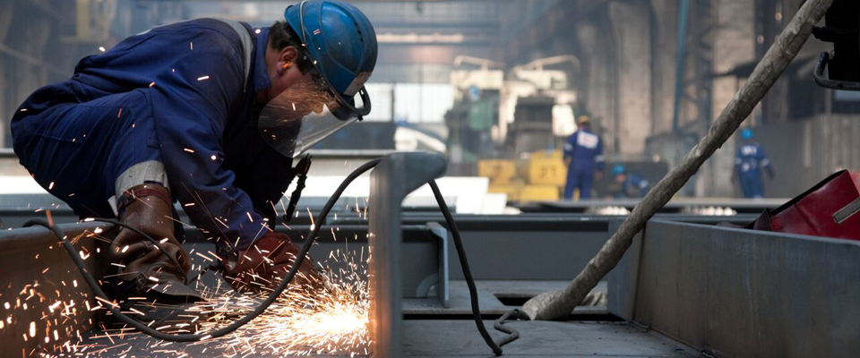 Picture of man cutting metal
