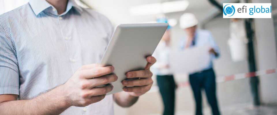 Picture of man holding tablet with EFI Global logo