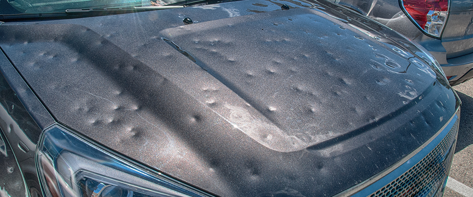 Picture of hail damage on a car